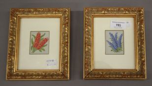 A pair of needlework floral pictures, each framed and glazed. 14.5 x 17.5 cm overall.