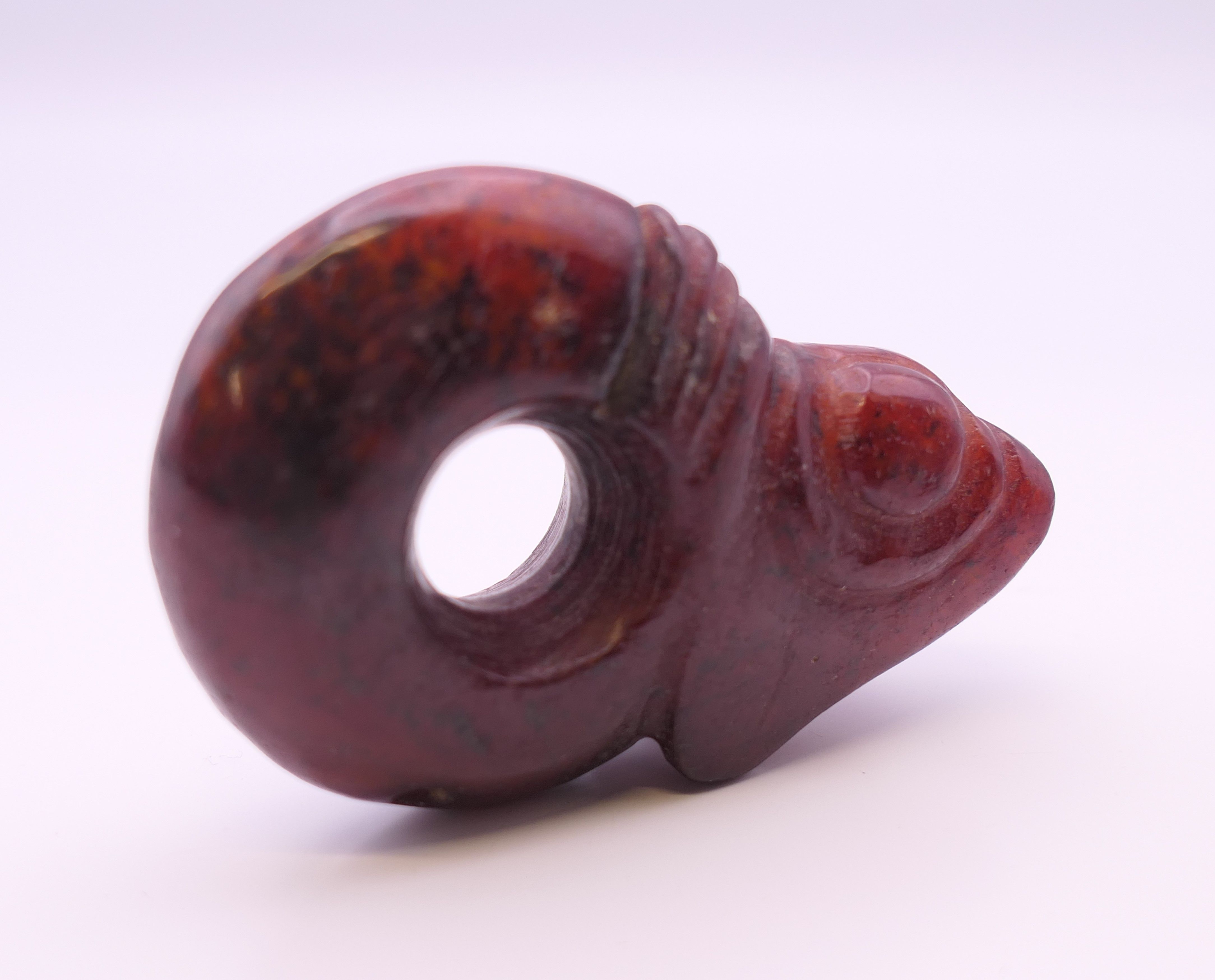 A Chinese red jade pig dragon, early Hongshan Culture. 6 cm long. - Image 5 of 6
