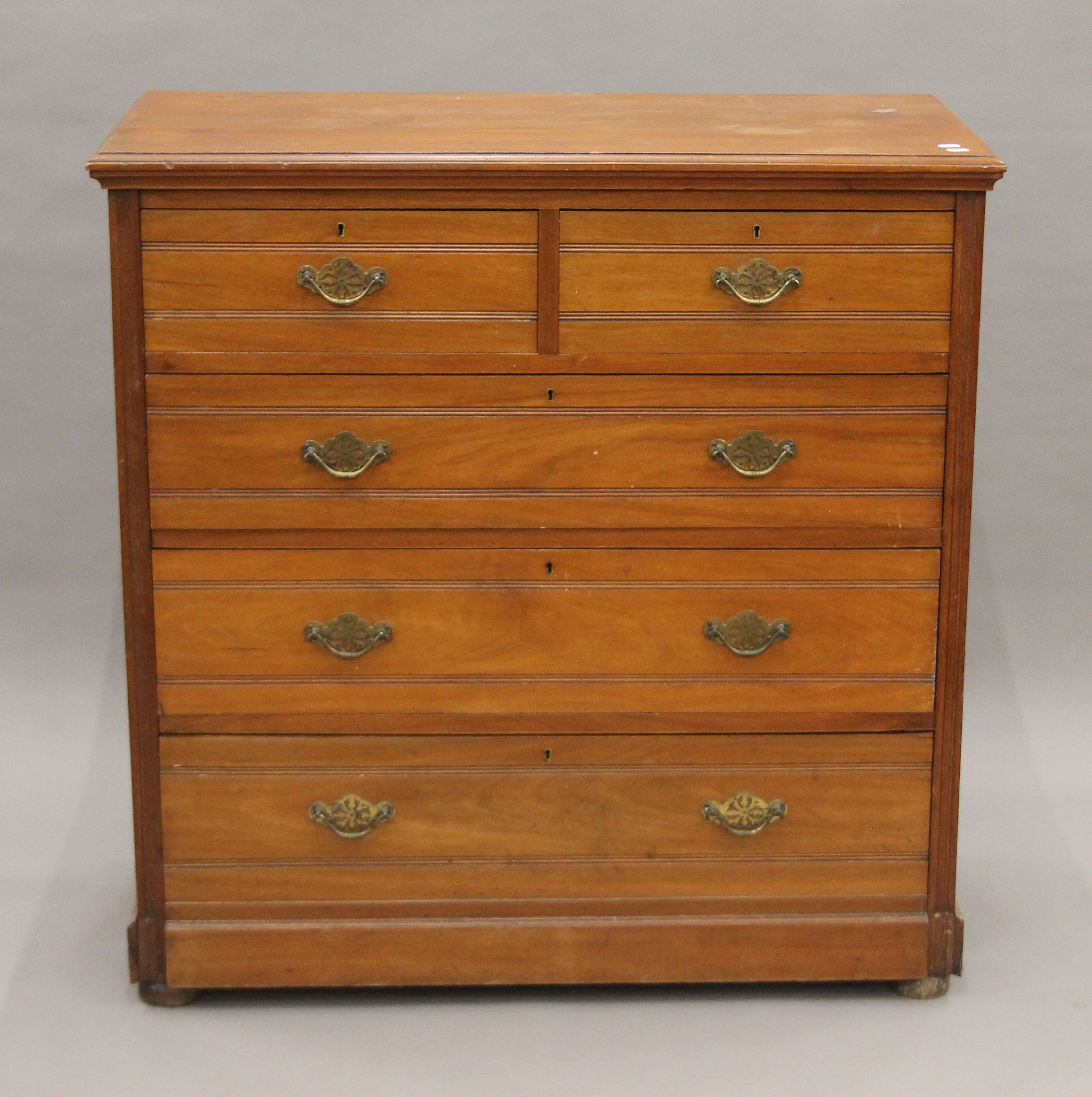 A Victorian walnut chest of drawers. 104.5 cm wide.