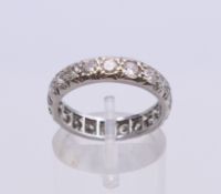 An unmarked white gold diamond eternity ring. Diamond weight approximately 2 carats. Ring size N. 4.