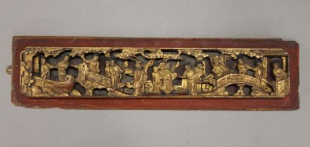 A Chinese gilt heightened carved wooden panel. 64 cm long.