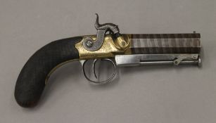 A 19th century percussion cap overcoat pistol. 20.5 cm long.