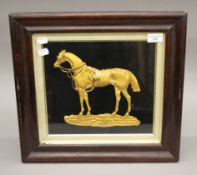 A 19th century gilt decorated profile of a horse, housed in a box frame. 43 x 40.5 cm overall.