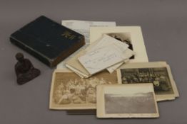 A photograph album of Colonial Burma and letters associated, and a carved wooden model of Buddha.