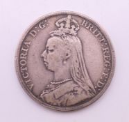 An 1889 silver crown coin.