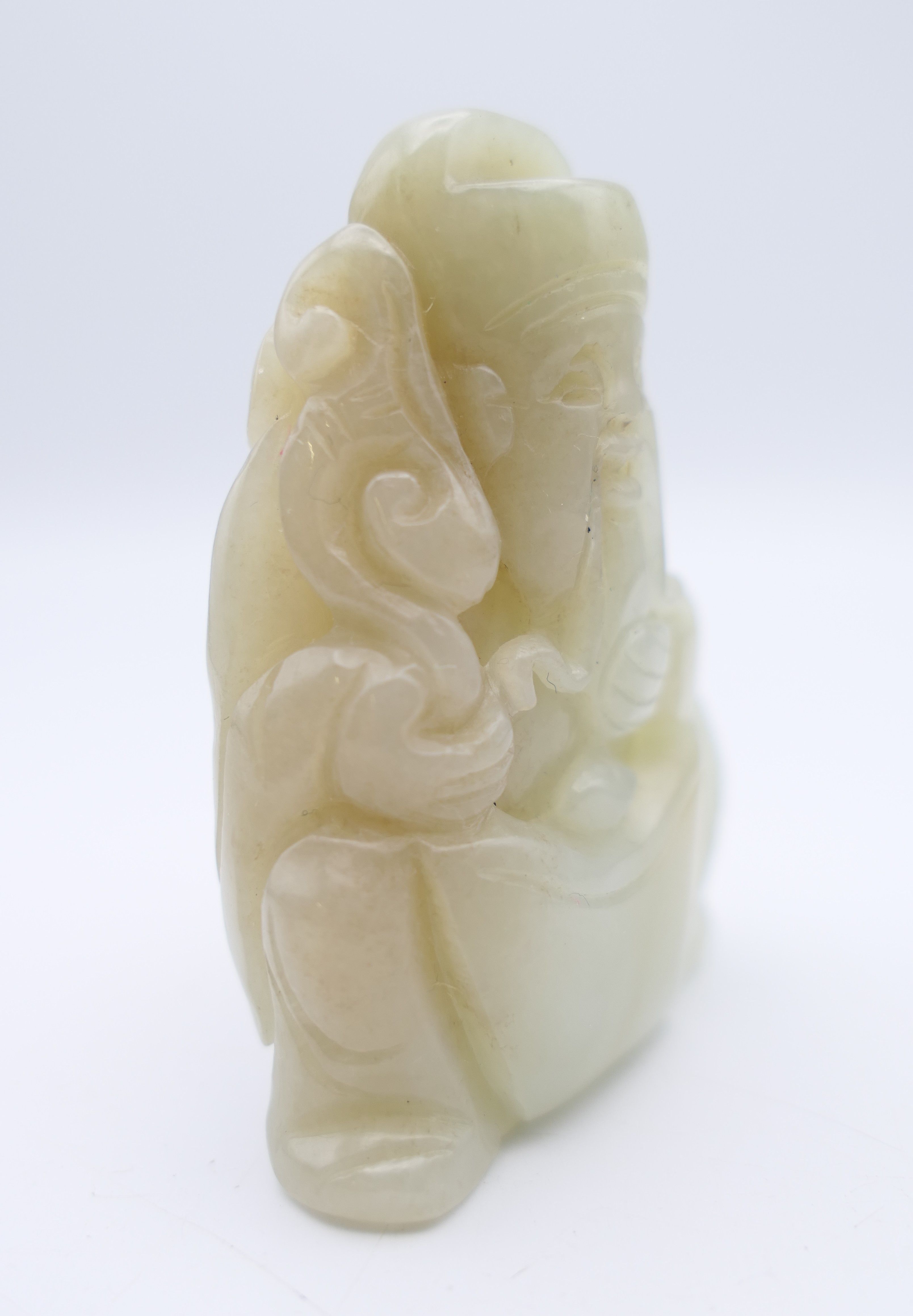 A Chinese light green jade carved figure of an old man, Qing Dynasty. 5.5 cm high. - Image 3 of 5
