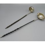 C18th silver toddy ladle with inset florin and twisted whalebone handle, overall length 32cm & a