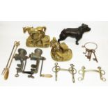 Brass model of a farrier, brass model of a blacksmith, two equestrian driving bits, two British-made