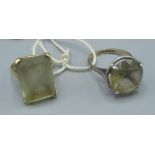 Two early C20th 9ct gold smoky quartz dress rings, 1 with lozenge shaped stone the other faceted