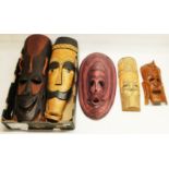 Five modern African tribal style wooden face masks, various sizes, the largest L64cm