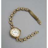 Collingwoods 9ct gold ladies hand wound wristwatch, signed silvered dial with applied Arabic