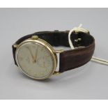 1950s Smiths Deluxe 9ct gold cased wristwatch, signed silvered dial with applied Arabic numerals,