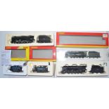 Four OO gauge electric steam locomotives by Hornby: R2248 "Super Detail" BR 2-10-0 Class 9F