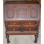 C20th oak bureau, fall front above two drawers on turned supports with stretchers W73 D45 H96