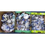 Large collection of Delft blue and white pottery including jugs, vases, milk jugs, windmills and