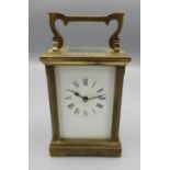 C20th brass carriage time piece, with white enamel Roman dial, movement stamped with makers