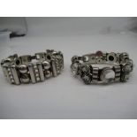 Two white metal Josh bracelets set with clear stones