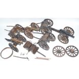 Three large cannon models in metal and wood with ammunition tenders and some spare wheel rims.