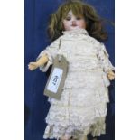 SFBJ Paris doll model 60 stamped 10/0, wearing a brown wig, silk ruffle dress and white shoes, H26cm
