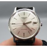 Longines automatic wristwatch with date. silvered dial with applied baton hour markers, outer minute