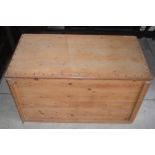 Pine rectangular blanket box with hinged brass studied lid and cast iron side carry handles, W90cm