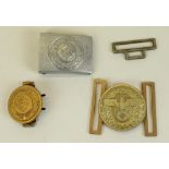 Two German Third Reich gilt metal belt buckles and a similar silvered metal belt buckle