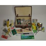 Collection of mostly fishing related tools and accessories, includes forceps, an Orvis knot tyer,