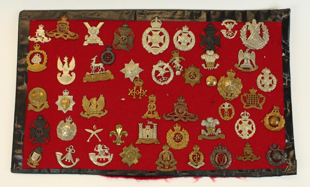 Mounted display of approx fifty various associated British Military cap badges, including Royal