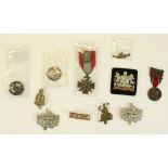 Two Services Rendered lapel badges, various British military cap badges, shoulder title, King's