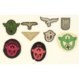 Selection of German WWII era Third Reich cloth patches and badges to include Luftwaffe breast eagle,