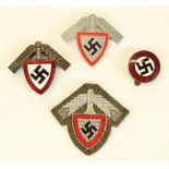 Three German Third Reich Labour Service badges and a NSDAP enamel badge