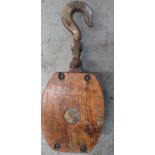 Large wood and metal ships pulley with registration numbers