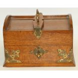 Late 19th early 20th century oak desktop humidor with metal mounts and cedar wood lined interior,