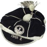 C20th velvet and silver bullion thread school or sports cap with woven crest in Latin for Neath,