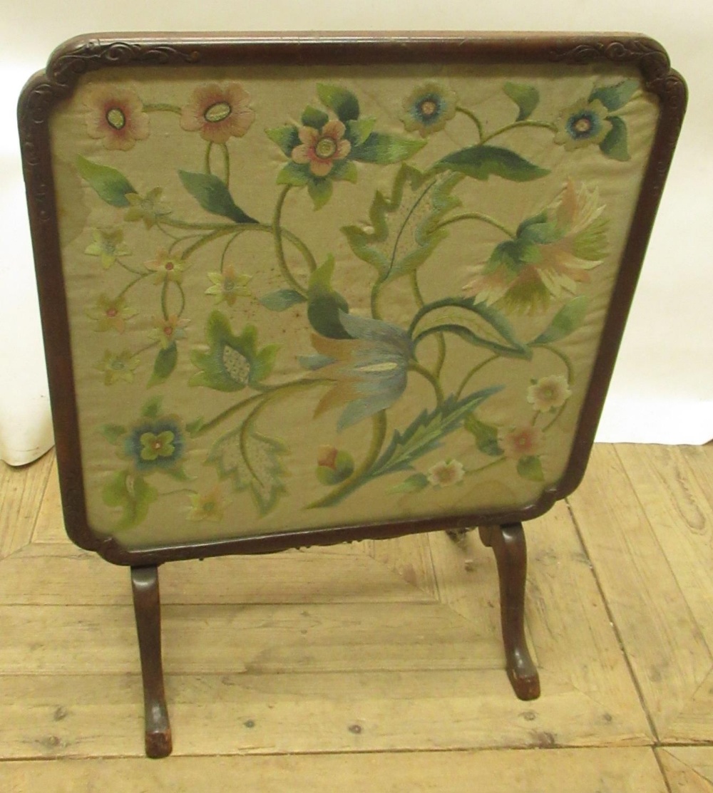 C20th mahogany framed fire screen table with inset silk work floral panel, on 4 splay legs