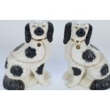 Pair of c19th Staffordshire pottery black spotted spaniels, H22cm