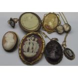 Four Victorian and later cameo brooches, all on yellow metal mounts, a similar clip with relief