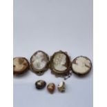 Four Victorian and later cameo brooches, all on yellow metal mounts, and three unmatched cameo