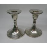 pair of Geo. V Art Deco period hallmarked Sterling silver dressing table candlesticks on circular