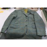 Haggar silk lined tweed jacket with single breast, outside breast pocket with flaps and two outer