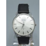 1960s Seiko hand wound wristwatch, with signed dial applied baton indices and central seconds,