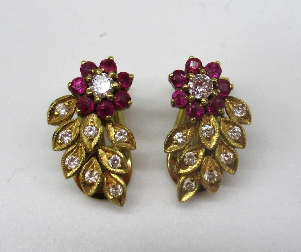 Pair of yellow metal earrings, the floral design set with brilliant cut diamonds and rubies, stamp/