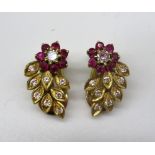 Pair of yellow metal earrings, the floral design set with brilliant cut diamonds and rubies, stamp/