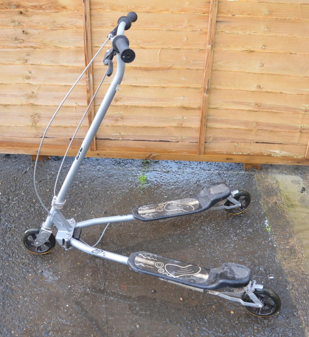 A Zip Sprinter scissor action scooter in full working order.