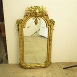 C20th arched top wall mirror, beaded border with mask cresting and , W51cm H97cm