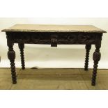 Victorian carved oak side table, with two scroll carved frieze drawers, on bobbin turn supports,