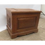 Late C20th golden oak blanket box with lift off panel lid, panelled sides with swan neck drop