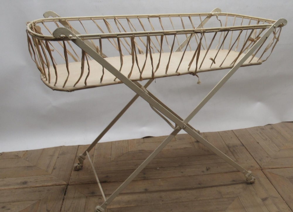 Early C20th folding wrought steel baby changing stand on marble casters, W49cm D104cm H80cm