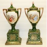 Pair of large Royal Vienna style twin handled pedestal urns and covers decorated with figural