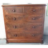 Victorian mahogany chest of two short and three long curl veneer drawers with turned handles, on